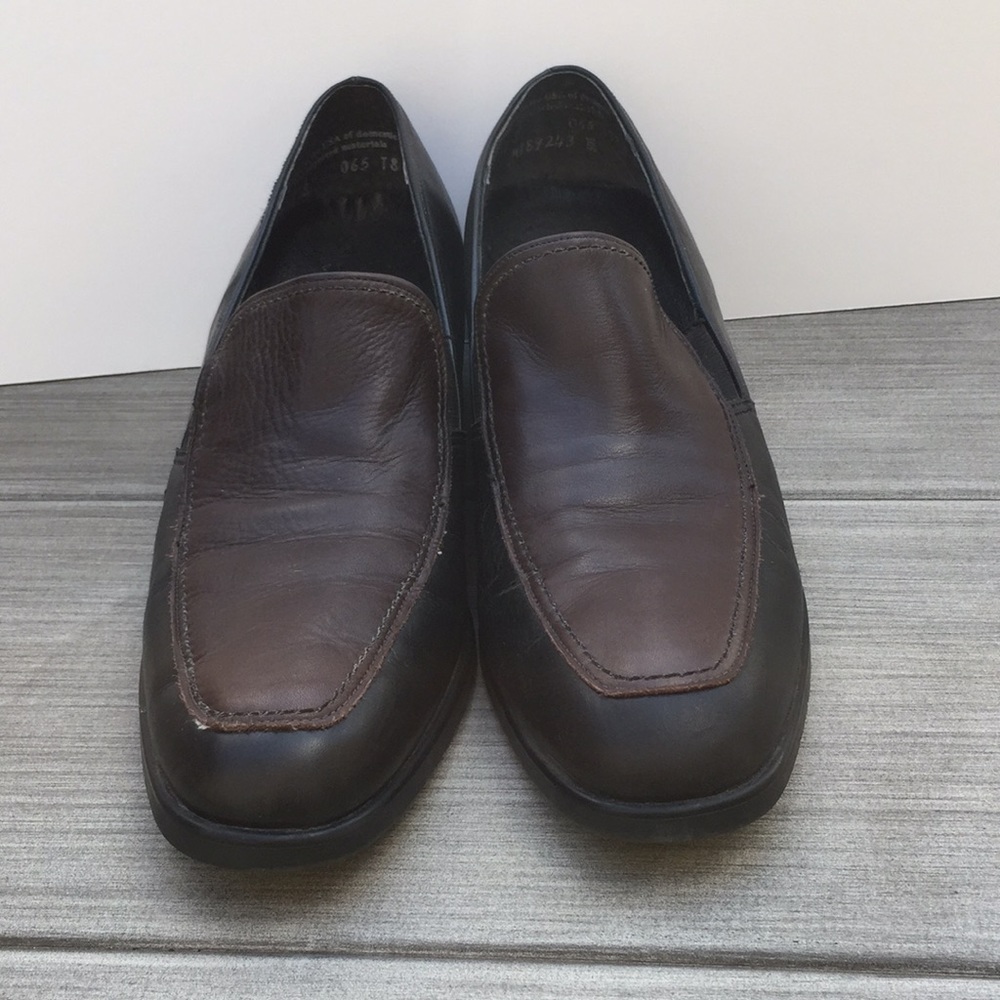 Black leather loafers with brown top